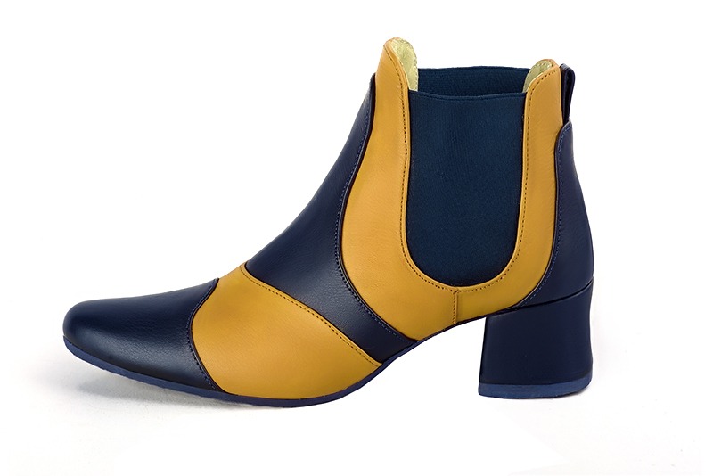 Navy blue and mustard yellow women's ankle boots, with elastics. Round toe. Low flare heels. Profile view - Florence KOOIJMAN